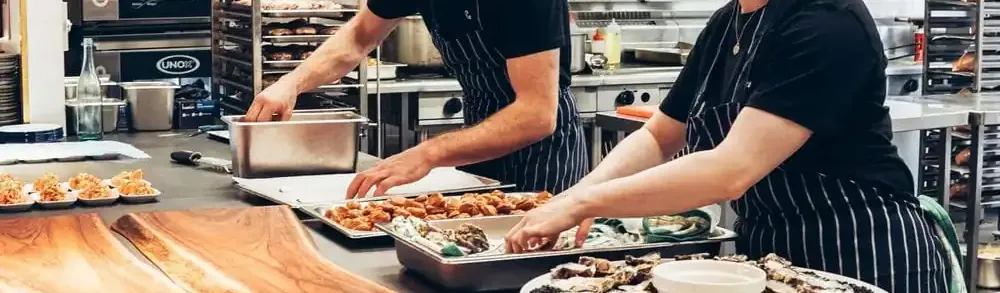 Environmental Health Officer conducting a restaurant kitchen inspection