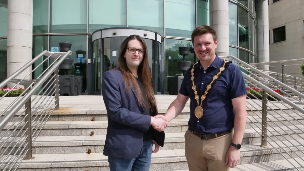 Conor shaking Lisburn mayor's hand